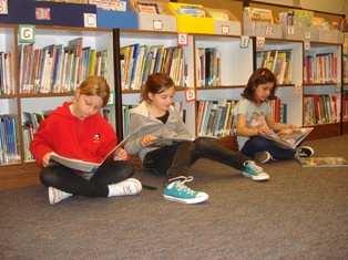 Students reading quietly in the library