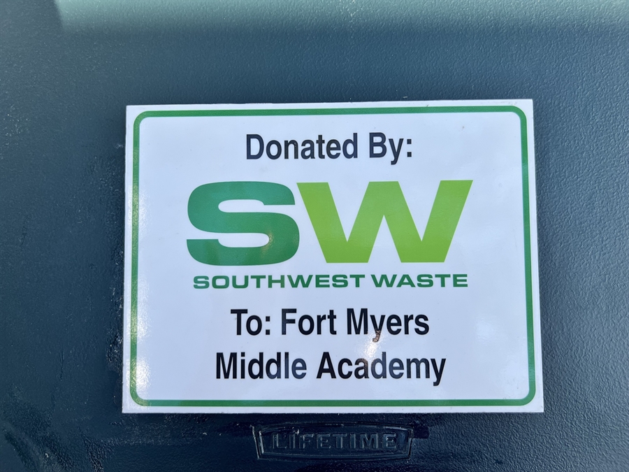 Picnic table with plaque noting donation from Southwest Waste