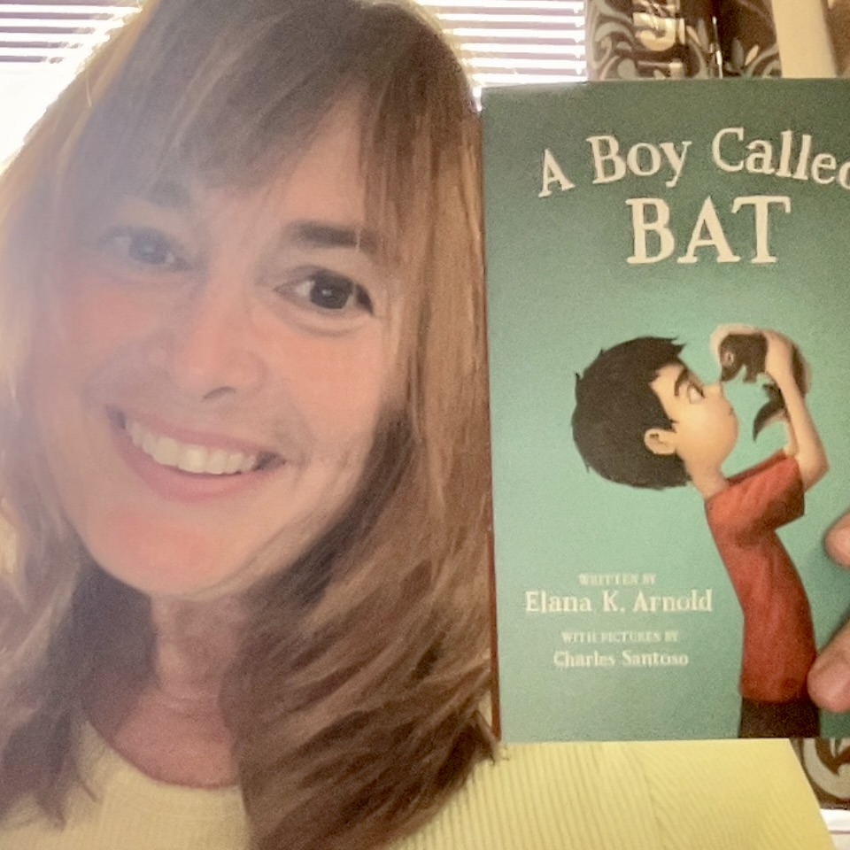 Photo of Mrs. Snyder holding a book