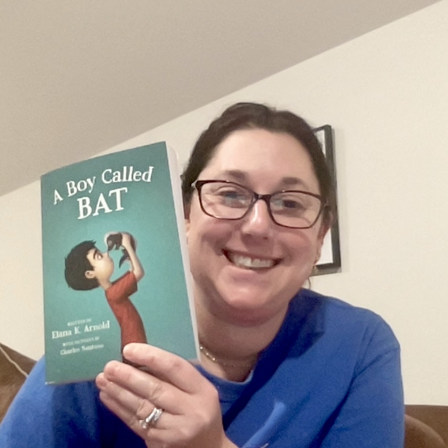 Photo of Mrs. Pfautz holding a book